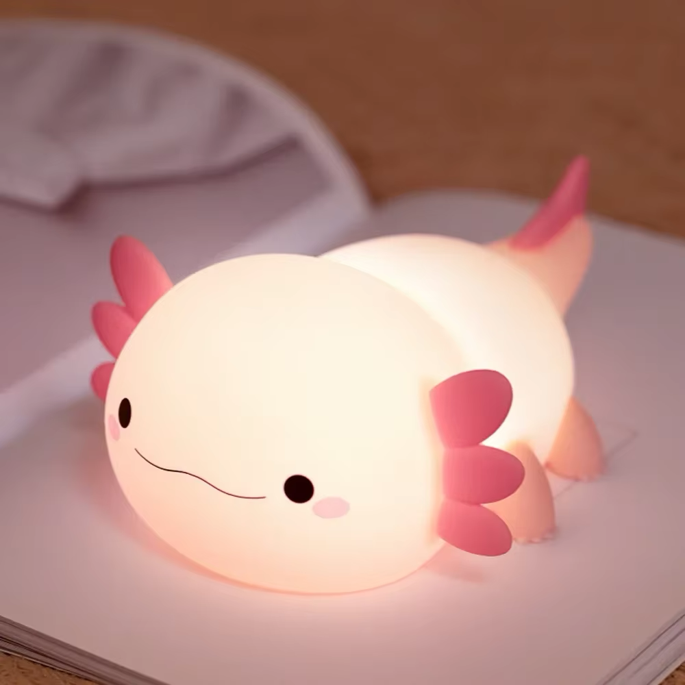 An adorable axolotl lamp emitting cozy light, perfect for relaxing evenings. Available at BlissfulGlow.