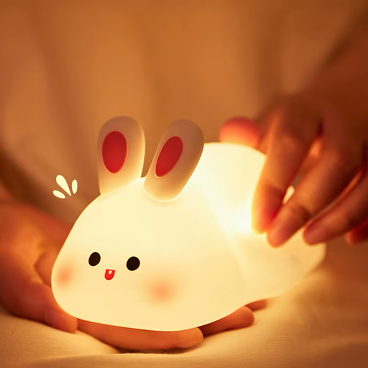 Cute bunny night light with a warm soft glow, perfect for creating a cozy atmosphere in any room. Available at BlissfulGlow