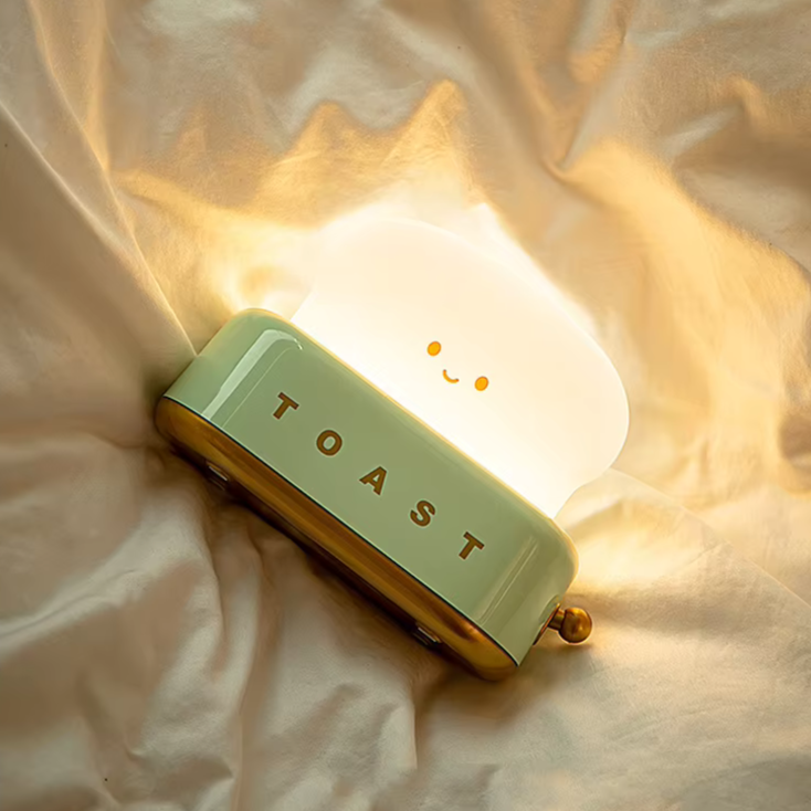 Cute toast lamp , ideal for a cozy and warm bedroom ambiance. Available at BlissfulGlow.