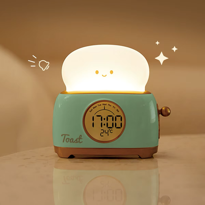 Cute green toaster-shaped alarm clock featuring a warm night light and precise digital display, ideal for stylish and practical home settings, at BlissfulGlow.