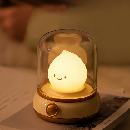 Night light with a warm beige base, emitting a soft LED glow for a cozy atmosphere, available at BlissfulGlow.