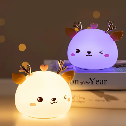 Reindeer-shaped night lights with color-changing modes, offering soft illumination in both warm white and vibrant purple hues, available at BlissfulGlow.