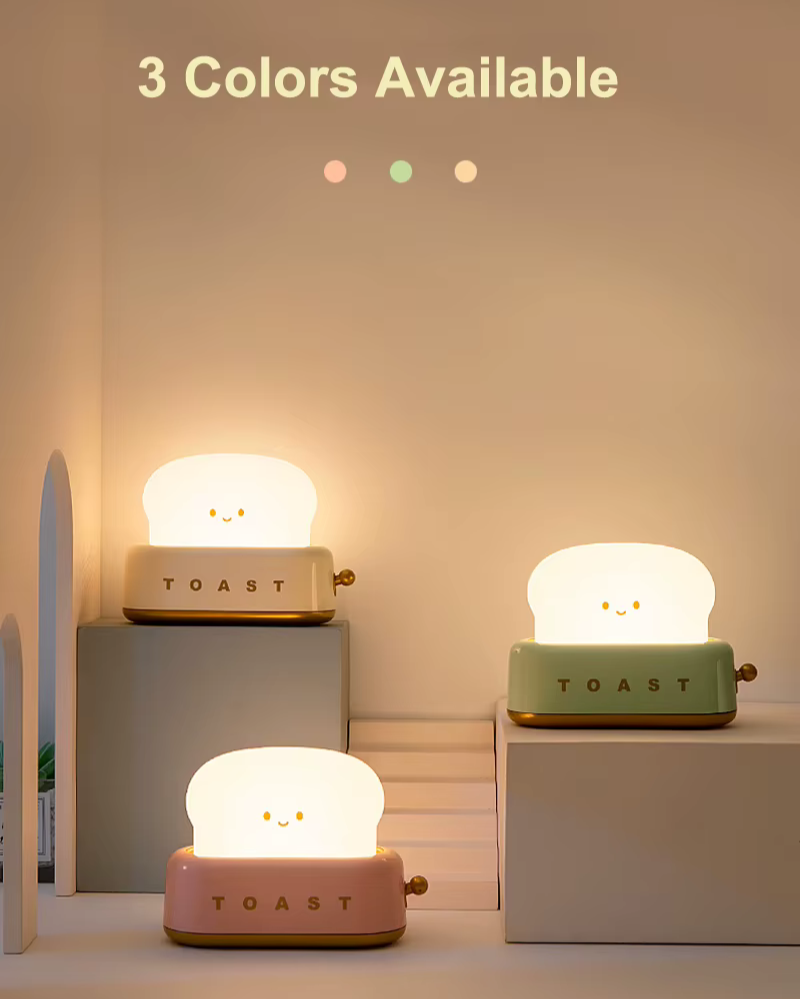 Toaster-shaped night light obtainable in three colors: beige, green and pink. Perfect for personalizing your space with a soft and warm glow. Available at BlissfulGlow.