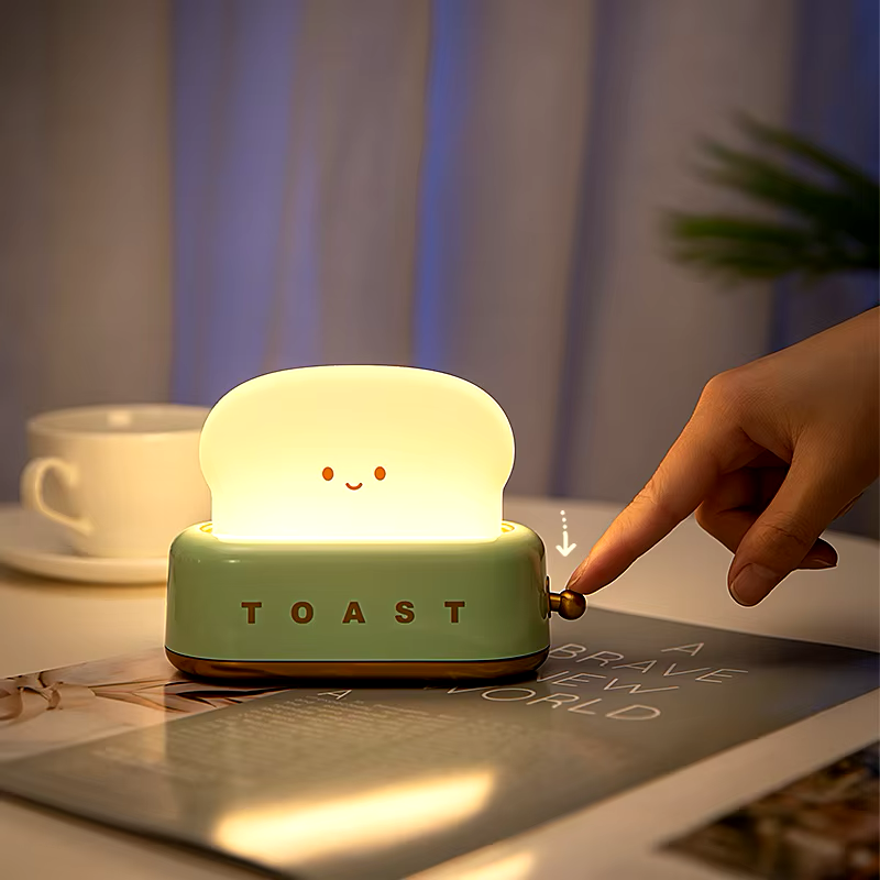 Toaster-shaped night light with touch control for adjusting brightness, perfect for cozy and customizable lighting experience. Available at BlissfulGlow.