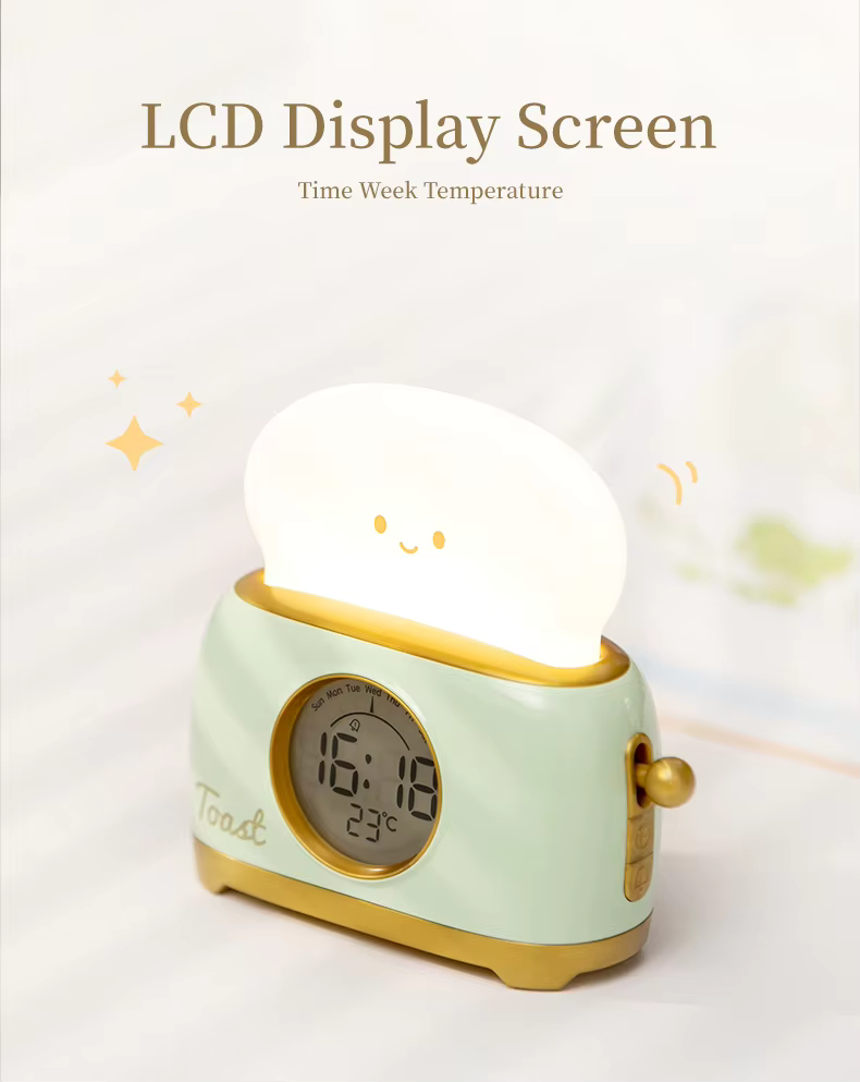 Toaster-shaped alarm clock with an LCD display showing time, day and temperature. Combines functionality with a cute design, available at BlissfulGlow.