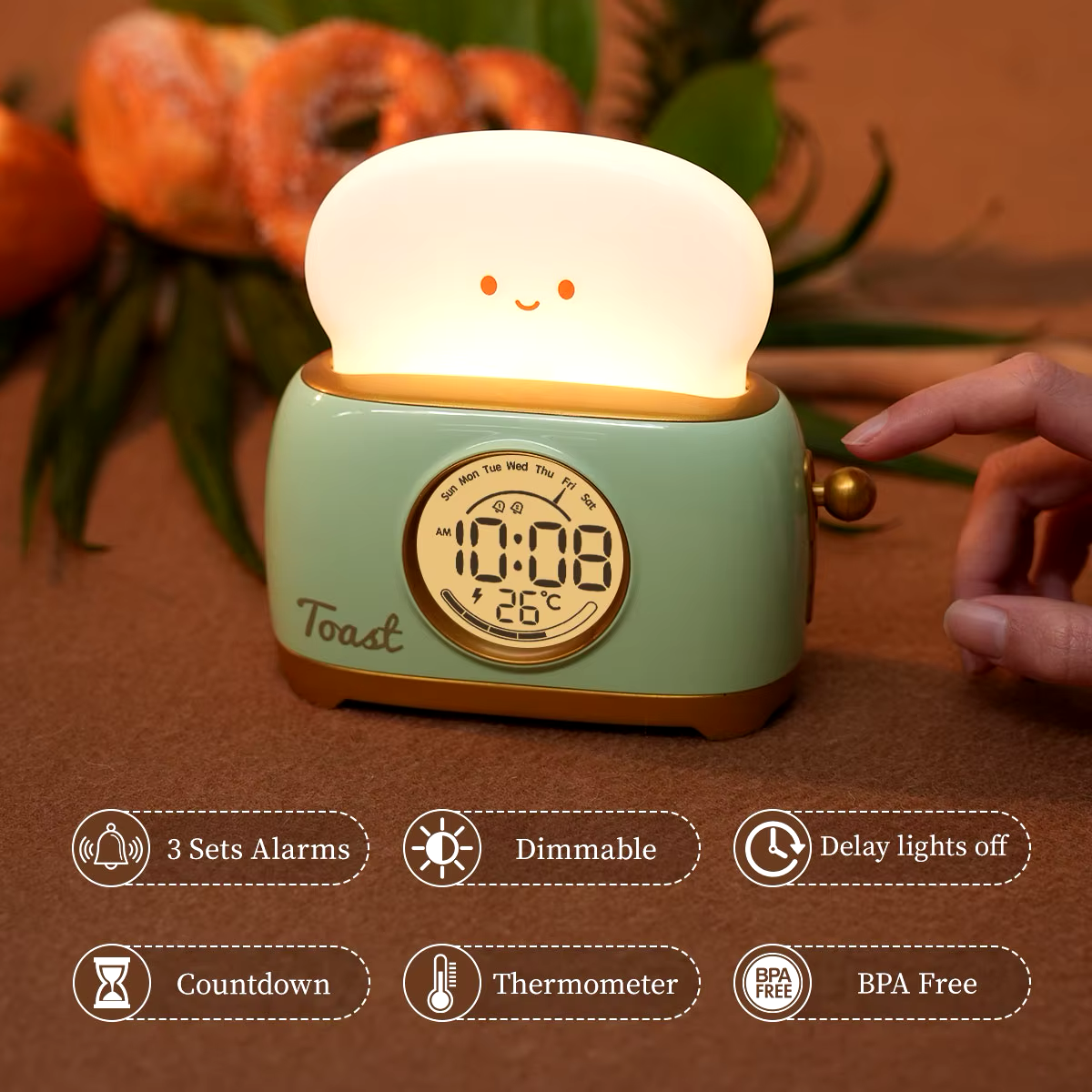 Multifunction toaster-shaped alarm clock and night light featuring 3 alarm settings, dimmable brightness, countdown timer, thermometer and BPA-free material. Available at Blissfulglow.